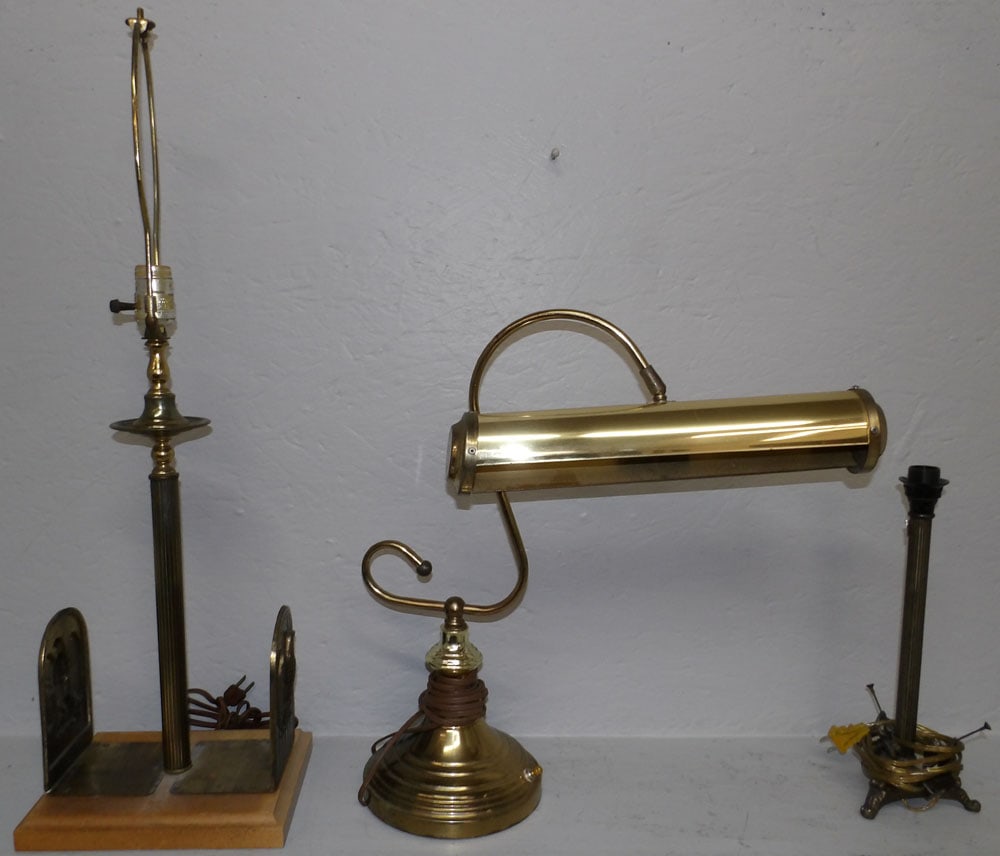 Three Brass Lamps: Three Brass Lamps. 29" H 9 1/2" W "ALL DESCRIPTIONS AND ANY CONDITION STATEMENT GIVEN BY LANGSTON AUCTION GALLERY ARE STRICTLY OPINIONS AND LANGSTON'S SHALL HAVE NO RESPONSIBILITY FOR ERRORS OR
