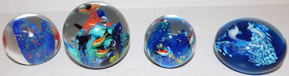 Lot of Four Art Glass Paperweights: Lot of Four Art Glass Paperweights . Up to 3" H 3" Dia. ALL DESCRIPTIONS AND ANY CONDITION STATEMENT GIVEN BY LANGSTON AUCTION GALLERY ARE STRICTLY OPINIONS AND LANGSTON'S SHALL HAVE NO RESPONSIBILITY