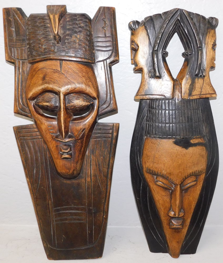 Two Carved Wood African Masks: Two Carved Wood African Masks. Up to 23 1/2" x 10" ALL DESCRIPTIONS AND ANY CONDITION STATEMENT GIVEN BY LANGSTON AUCTION GALLERY ARE STRICTLY OPINIONS AND LANGSTON'S SHALL HAVE NO RESPONSIBILITY