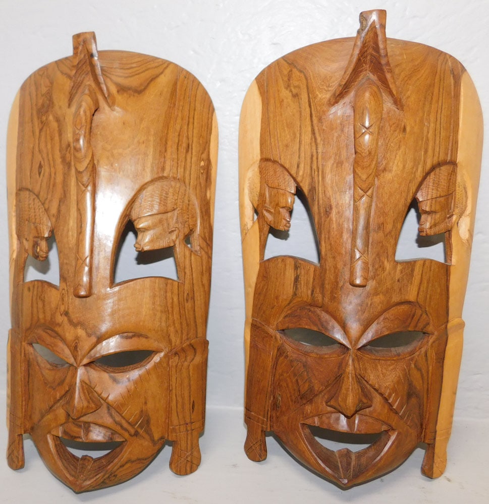 Two Carved Wood African Masks: Two Carved Wood African Masks. Up to 16" x 9" ALL DESCRIPTIONS AND ANY CONDITION STATEMENT GIVEN BY LANGSTON AUCTION GALLERY ARE STRICTLY OPINIONS AND LANGSTON'S SHALL HAVE NO RESPONSIBILITY FOR