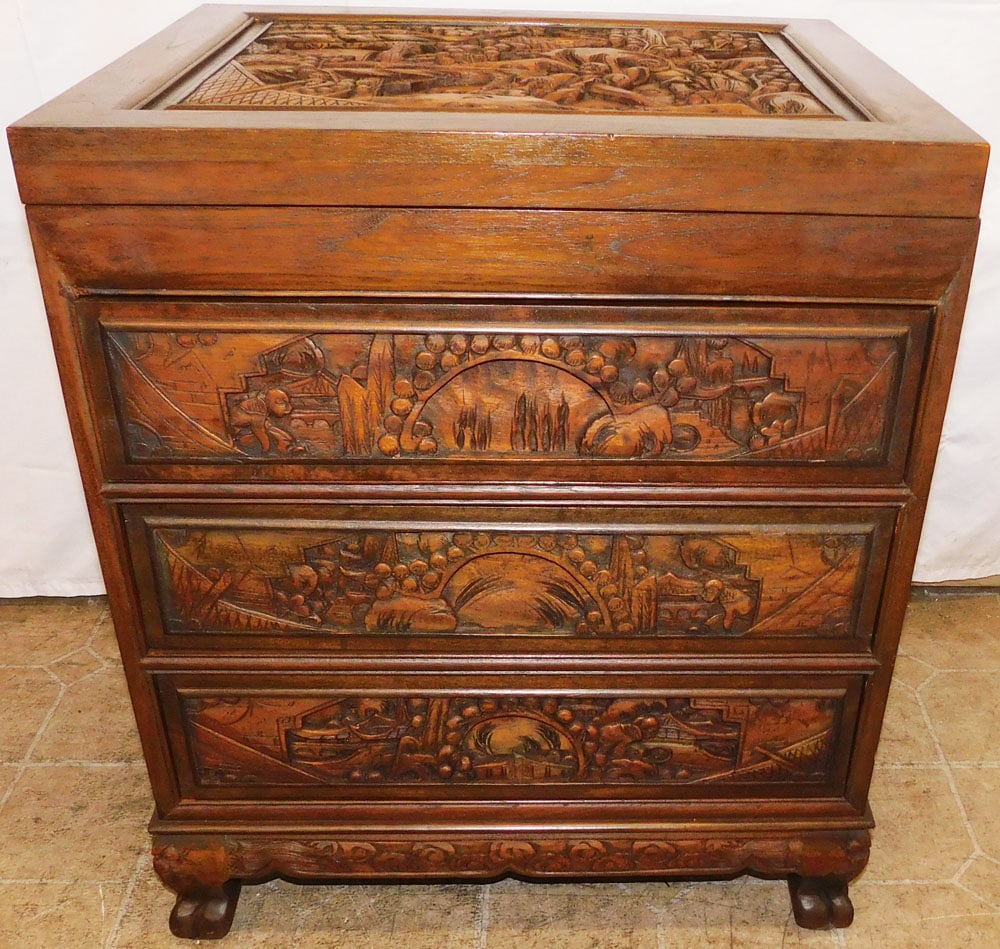 Carved High Relief Oriental Teak Wood Three Drawer Stand: Carved High Relief Oriental Teak Wood Three Drawer Stand . 26 1/4" H 27 3/4" W 18" D ALL DESCRIPTIONS AND ANY CONDITION STATEMENT GIVEN BY LANGSTON AUCTION GALLERY ARE STRICTLY OPINIONS AND