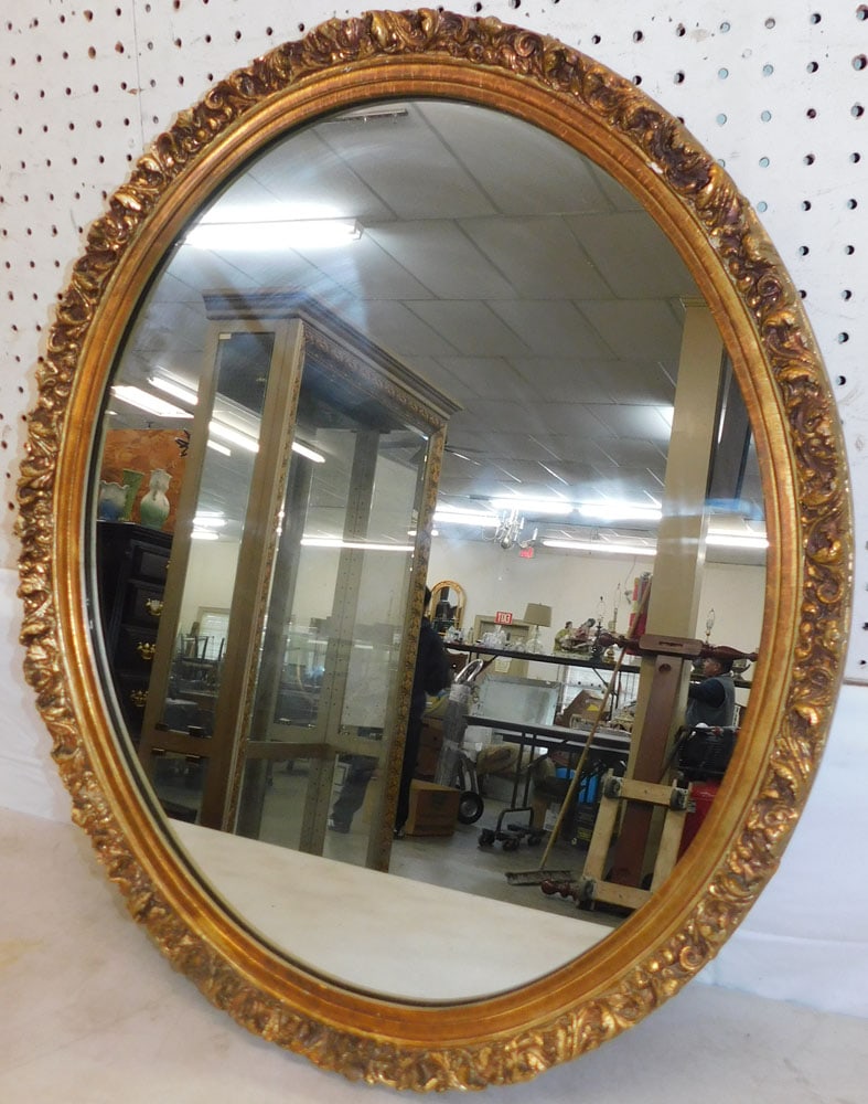 Gilded Frame Oval Mirror: Gilded Frame Oval Mirror . 27" x 22 3/4" ALL DESCRIPTIONS AND ANY CONDITION STATEMENT GIVEN BY LANGSTON AUCTION GALLERY ARE STRICTLY OPINIONS AND LANGSTON'S SHALL HAVE NO RESPONSIBILITY FOR ERRORS OR