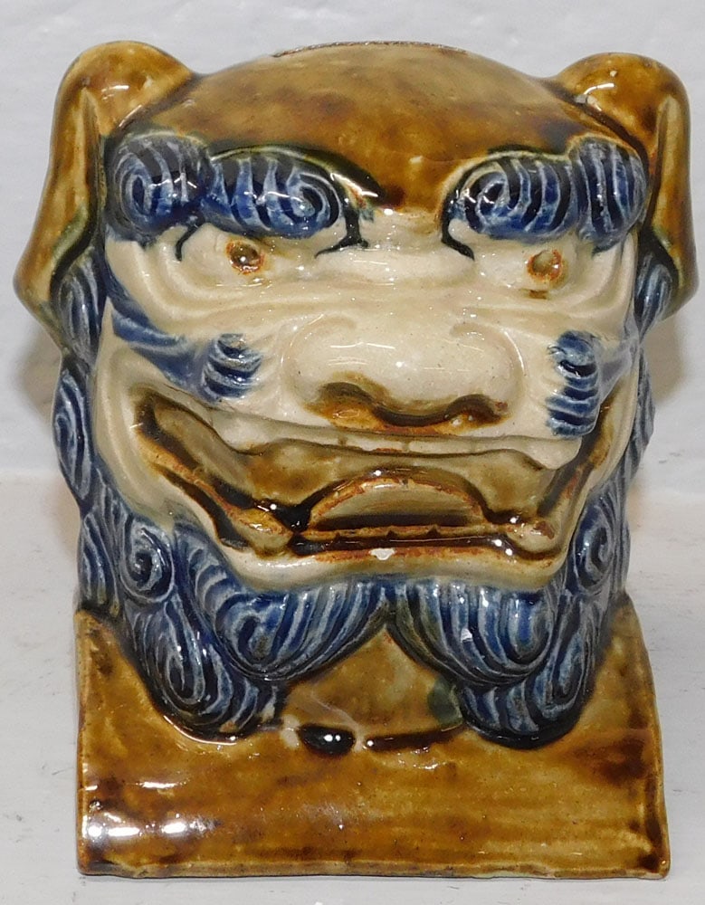 Oriental Porcelain Foo Dog Head Coin Bank: Oriental Porcelain Foo Dog Head Coin Bank . 5 3/4" H 4 1/2" Dia. ALL DESCRIPTIONS AND ANY CONDITION STATEMENT GIVEN BY LANGSTON AUCTION GALLERY ARE STRICTLY OPINIONS AND LANGSTON'S SHALL HAVE NO