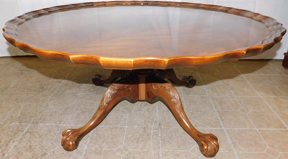 Crotch Mahogany Pie Crust Top Coffee Table with Ball & Claw Feet by Henredon: Crotch Mahogany Pie Crust Top Coffee Table with Ball & Claw Feet by Henredon. 19 1/4" H 42" Dia. ALL DESCRIPTIONS AND ANY CONDITION STATEMENT GIVEN BY LANGSTON AUCTION GALLERY ARE STRICTLY OPINIONS AN
