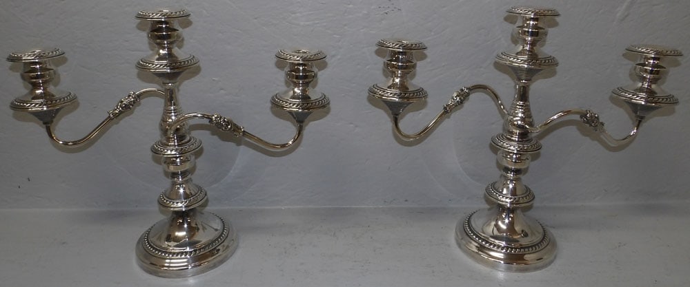 Pair of Silverplated Three Light Candelabras: Pair of Silverplated Three Light Candelabras . 14" H 17" W ALL DESCRIPTIONS AND ANY CONDITION STATEMENT GIVEN BY LANGSTON AUCTION GALLERY ARE STRICTLY OPINIONS AND LANGSTON'S SHALL HAVE NO RESPONSIBIL