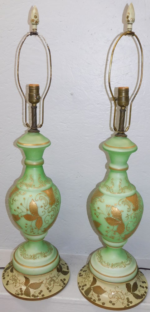 Pair of Mid Century Green Opaque Satin Glass & Gold Motif Lamps on Decorated Wood Bases: Pair of Mid Century Green Opaque Satin Glass & Gold Motif Lamps on Decorated Wood Bases. 35 1/4" H 9 1/4" Dia. ALL DESCRIPTIONS AND ANY CONDITION STATEMENT GIVEN BY LANGSTON AUCTION GALLERY ARE