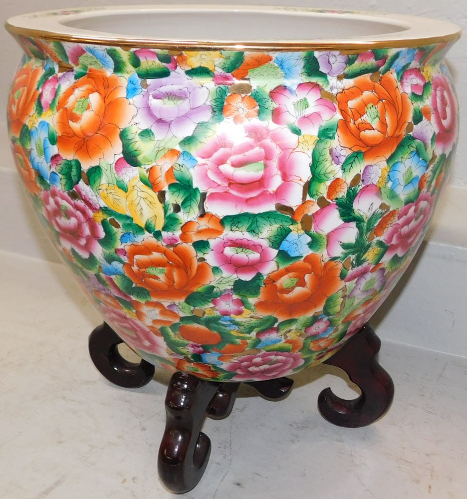 Oriental Porcelain Jardiniere on Teak Wood Stand: Oriental Porcelain Jardiniere on Teak Wood Stand . 16 1/4" H 15 1/4" Dia. ALL DESCRIPTIONS AND ANY CONDITION STATEMENT GIVEN BY LANGSTON AUCTION GALLERY ARE STRICTLY OPINIONS AND LANGSTON'S SHALL HAVE