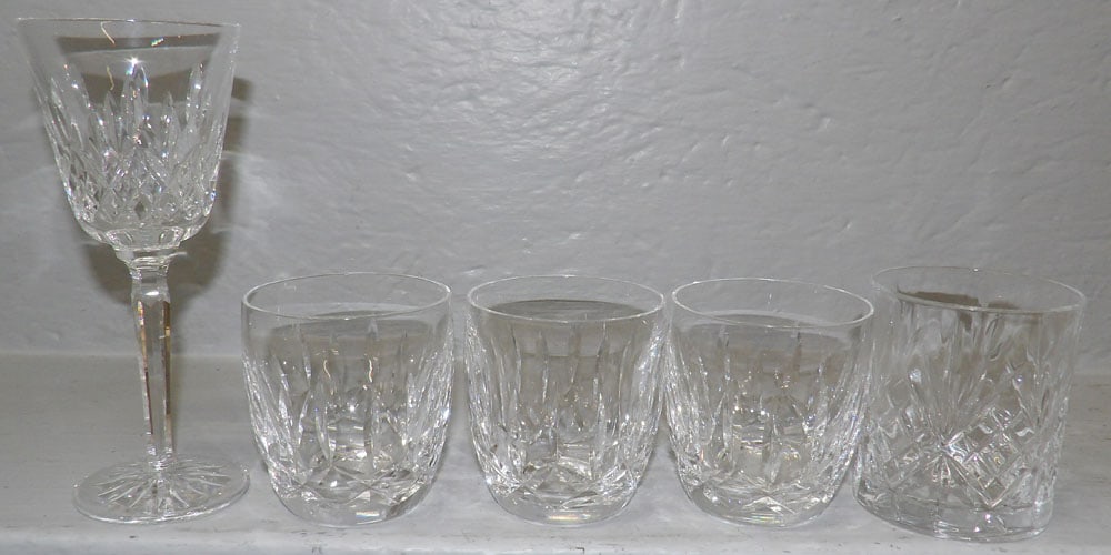 Four Waterford Crystal Cocktails & One Waterford Wine: Four Waterford Crystal Cocktails & One Waterford Wine . 7 1/4" H 3 1/4" Dia. ALL DESCRIPTIONS AND ANY CONDITION STATEMENT GIVEN BY LANGSTON AUCTION GALLERY ARE STRICTLY OPINIONS AND LANGSTON'S