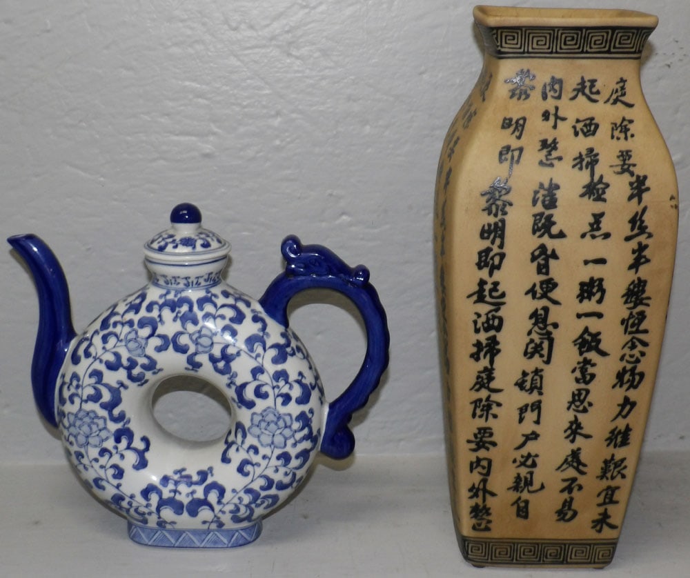 Oriental Blue & White Circle Hole Teapot & Vase with Calligraphy Motif: Oriental Blue & White Circle Hole Teapot & Vase with Calligraphy Motif. Up to 15" H 5 3/4" Dia. ALL DESCRIPTIONS AND ANY CONDITION STATEMENT GIVEN BY LANGSTON AUCTION GALLERY ARE STRICTLY OPINIONS