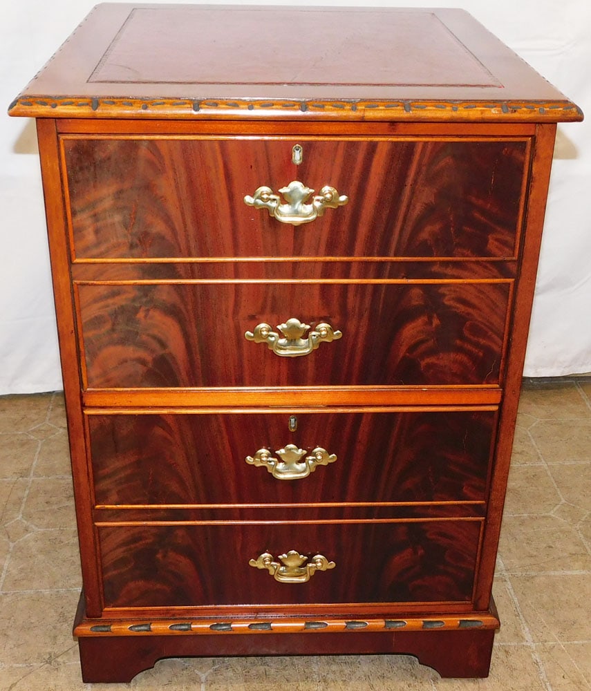 Flame Mahogany Tooled Leather Top Two Drawer Filing Cabinet: Flame Mahogany Tooled Leather Top Two Drawer Filing Cabinet . 30 1/2" H 22" W 23 3/4" D ALL DESCRIPTIONS AND ANY CONDITION STATEMENT GIVEN BY LANGSTON AUCTION GALLERY ARE STRICTLY OPINIONS AND LANGSTO