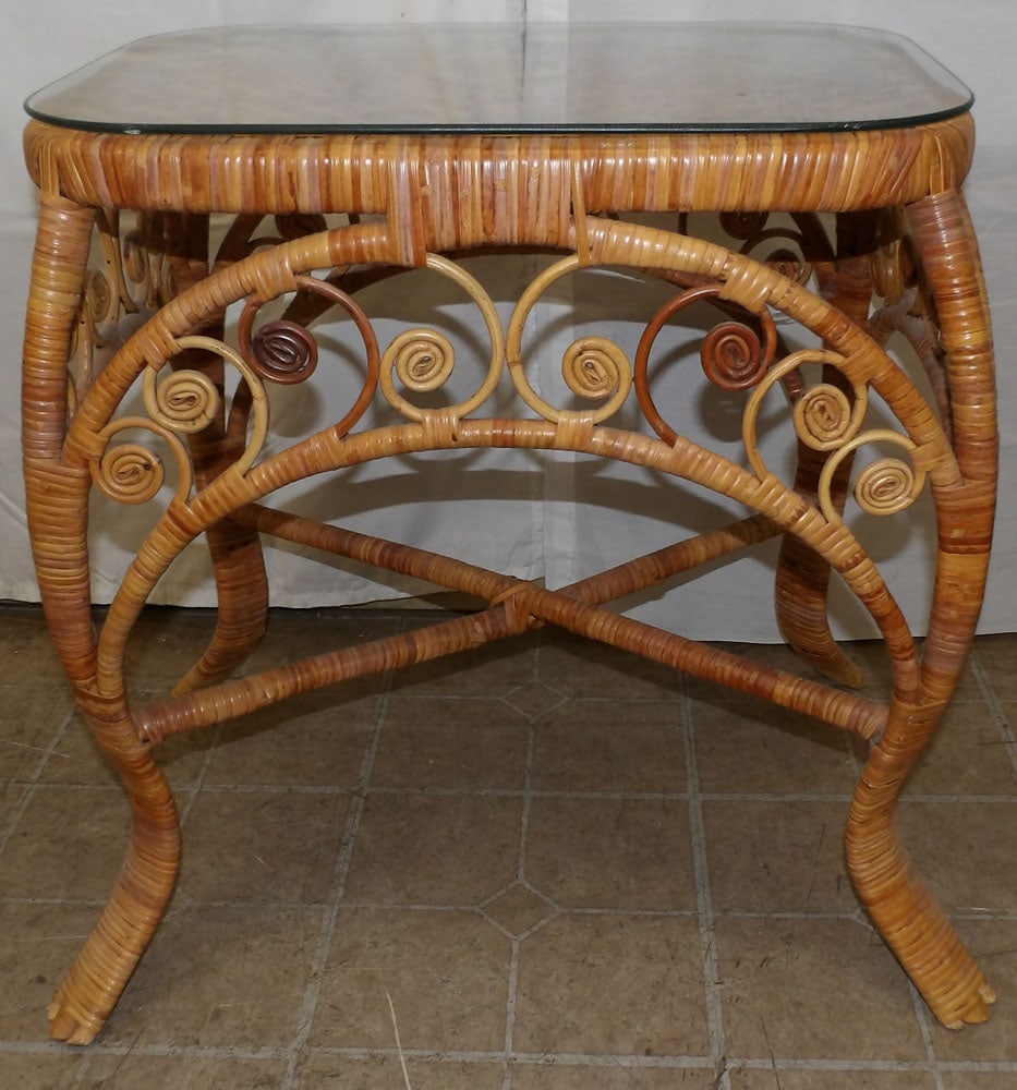 Wicker Lamp Table with Glass Top: Wicker Lamp Table with Glass Top. 25 1/4" H 27 1/2" W 19" D ALL DESCRIPTIONS AND ANY CONDITION STATEMENT GIVEN BY LANGSTON AUCTION GALLERY ARE STRICTLY OPINIONS AND LANGSTON'S SHALL HAVE NO