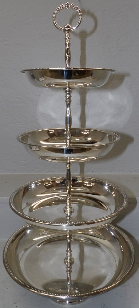 Silverplated Four Tier Epergne: Silverplated Four Tier Epergne . 25" H 12 1/2" Dia. ALL DESCRIPTIONS AND ANY CONDITION STATEMENT GIVEN BY LANGSTON AUCTION GALLERY ARE STRICTLY OPINIONS AND LANGSTON'S SHALL HAVE NO RESPONSIBILITY