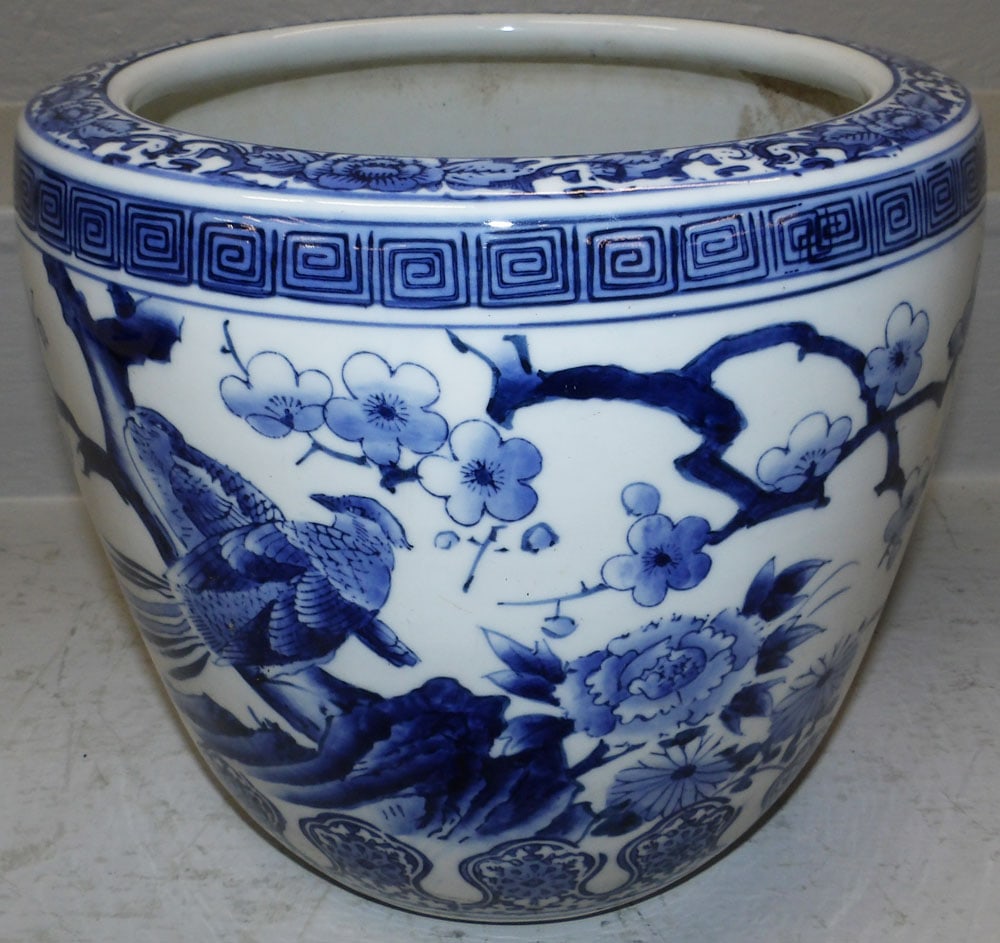 Oriental Porcelain Blue & White Jardiniere with Pheasant Motif: Oriental Porcelain Blue & White Jardiniere with Pheasant Motif. 9 1/2" H 11" Dia. ALL DESCRIPTIONS AND ANY CONDITION STATEMENT GIVEN BY LANGSTON AUCTION GALLERY ARE STRICTLY OPINIONS AND LANGSTON'S SH