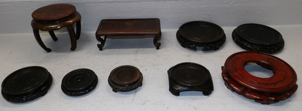 Lot of Oriental Teak Wood Stands: Lot of Oriental Teak Wood Stands . Up to 3" H 9 1/4" W 5" D ALL DESCRIPTIONS AND ANY CONDITION STATEMENT GIVEN BY LANGSTON AUCTION GALLERY ARE STRICTLY OPINIONS AND LANGSTON'S SHALL HAVE NO RESPONSIBI