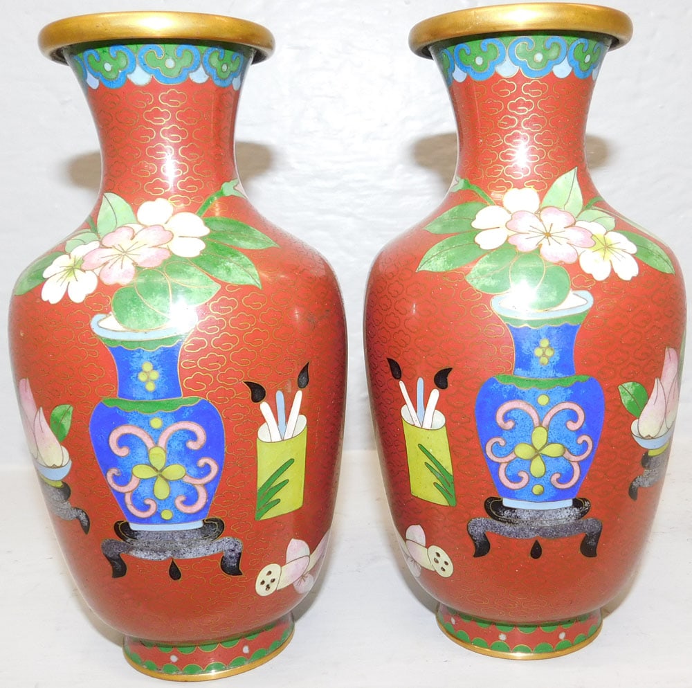 Pair of Oriental Cloisonne Vases: Pair of Oriental Cloisonne Vases. 7" H 3 3/4" Dia. ALL DESCRIPTIONS AND ANY CONDITION STATEMENT GIVEN BY LANGSTON AUCTION GALLERY ARE STRICTLY OPINIONS AND LANGSTON'S SHALL HAVE NO RESPONSIBILITY FOR