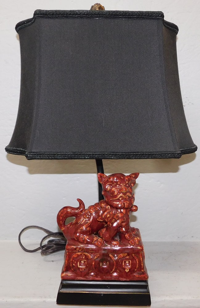 Chinese Sang de Bouef Porcelain Foo Dog Lamp: Chinese Sang de Bouef Porcelain Foo Dog Lamp. 19 3/4" H 14 1/4" W 9 1/4" D ALL DESCRIPTIONS AND ANY CONDITION STATEMENT GIVEN BY LANGSTON AUCTION GALLERY ARE STRICTLY OPINIONS AND LANGSTON'S SHALL