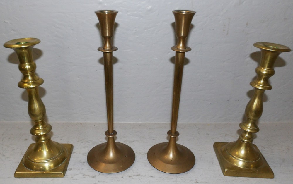 Two Pair of Antique Brass Candelsticks: Two Pair of Antique Brass Candelsticks. 10 1/2" H 3 1/2" Dia. ALL DESCRIPTIONS AND ANY CONDITION STATEMENT GIVEN BY LANGSTON AUCTION GALLERY ARE STRICTLY OPINIONS AND LANGSTON'S SHALL HAVE NO