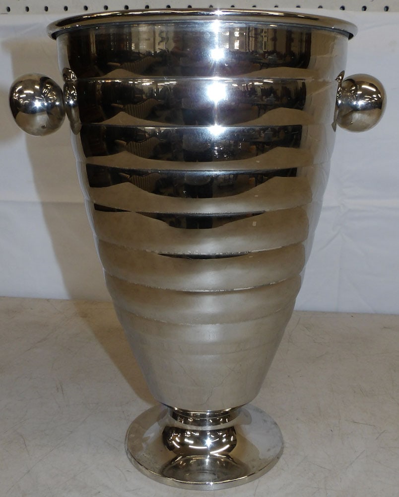 Silverplated Champagne Bucket: Silverplated Champagne Bucket. 12" H 10" W ALL DESCRIPTIONS AND ANY CONDITION STATEMENT GIVEN BY LANGSTON AUCTION GALLERY ARE STRICTLY OPINIONS AND LANGSTON'S SHALL HAVE NO RESPONSIBILITY FOR ERRORS