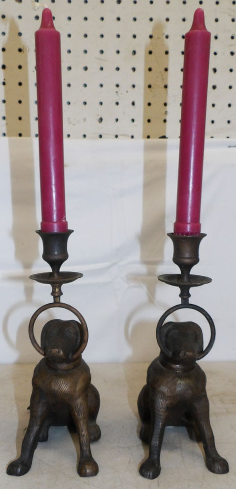 Pair of Bronze Dog Form Candlesticks: Pair of Bronze Dog Form Candlesticks . 8 3/4" H 3 1/2" W 6 1/4" D ALL DESCRIPTIONS AND ANY CONDITION STATEMENT GIVEN BY LANGSTON AUCTION GALLERY ARE STRICTLY OPINIONS AND LANGSTON'S SHALL HAVE NO