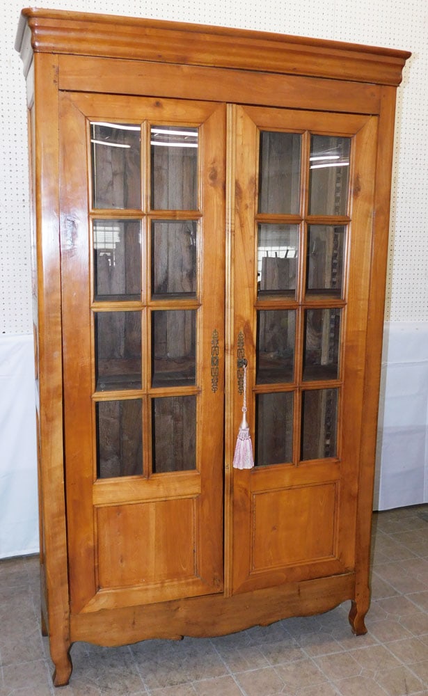Antique Cherry French Provincial Glass Door Bookcase Cabinet: Antique Cherry French Provincial Glass Door Bookcase Cabinet. 84 1/4" H 49 3/34 W 17" D ALL DESCRIPTIONS AND ANY CONDITION STATEMENT GIVEN BY LANGSTON AUCTION GALLERY ARE STRICTLY OPINIONS AND