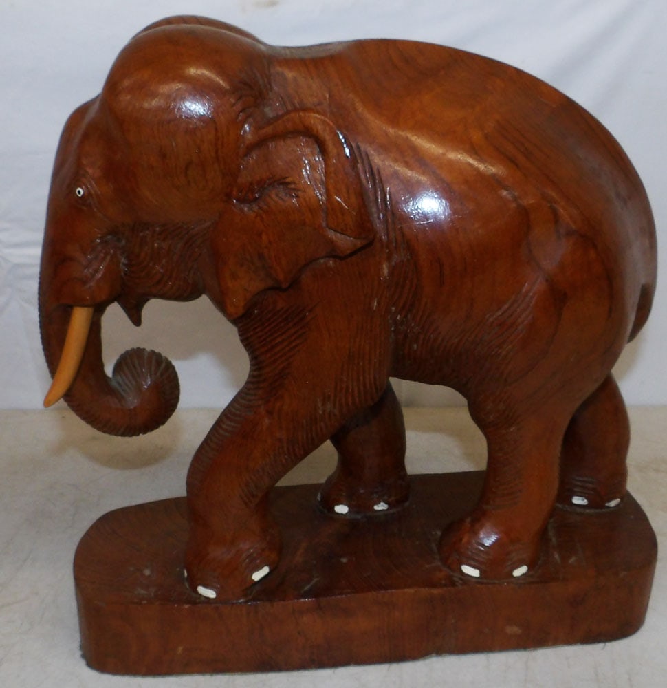 Carved Wood Elephant Statue: Carved Wood Elephant Statue . 12 3/4" H 13" W 4 1/2" D ALL DESCRIPTIONS AND ANY CONDITION STATEMENT GIVEN BY LANGSTON AUCTION GALLERY ARE STRICTLY OPINIONS AND LANGSTON'S SHALL HAVE NO