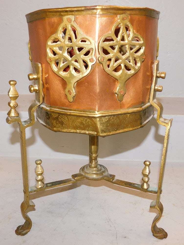 Copper & Brass Jardiniere on Stand: Copper & Brass Jardiniere on Stand . 16" H 11" Dia. ALL DESCRIPTIONS AND ANY CONDITION STATEMENT GIVEN BY LANGSTON AUCTION GALLERY ARE STRICTLY OPINIONS AND LANGSTON'S SHALL HAVE NO RESPONSIBILITY FOR