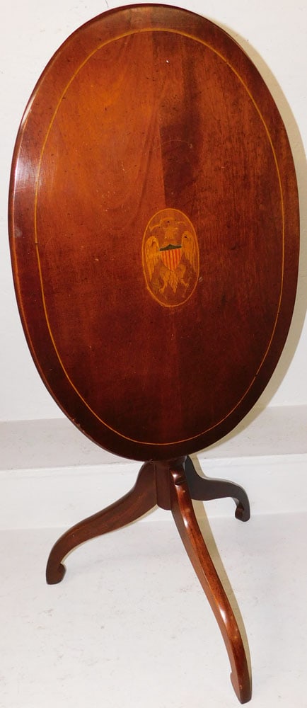 Oval Mahogany & Eagle Inlaid Tilt Top Candlestand: Oval Mahogany & Eagle Inlaid Tilt Top Candlestand . 26" H 25 3/4" W 17 1/2" D ALL DESCRIPTIONS AND ANY CONDITION STATEMENT GIVEN BY LANGSTON AUCTION GALLERY ARE STRICTLY OPINIONS AND LANGSTON'S