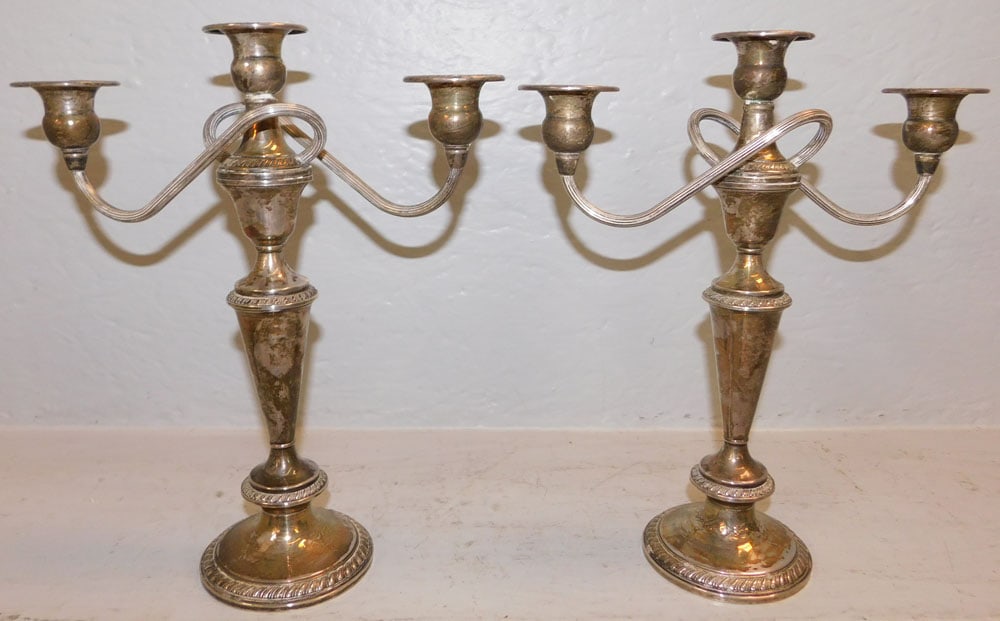 Pair of Sterling Weighted Three Light Candelabras by Crown: Pair of Sterling Weighted Three Light Candelabras by Crown. 11 1/4" H 9 1/2" W ALL DESCRIPTIONS AND ANY CONDITION STATEMENT GIVEN BY LANGSTON AUCTION GALLERY ARE STRICTLY OPINIONS AND LANGSTON'S SHALL