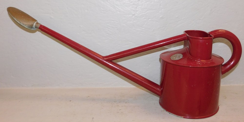 Painted Galvanized & Copper Spout Watering Can: Painted Galvanized & Copper Spout Watering Can. 9" H 27 1/2" W ALL DESCRIPTIONS AND ANY CONDITION STATEMENT GIVEN BY LANGSTON AUCTION GALLERY ARE STRICTLY OPINIONS AND LANGSTON'S SHALL HAVE NO