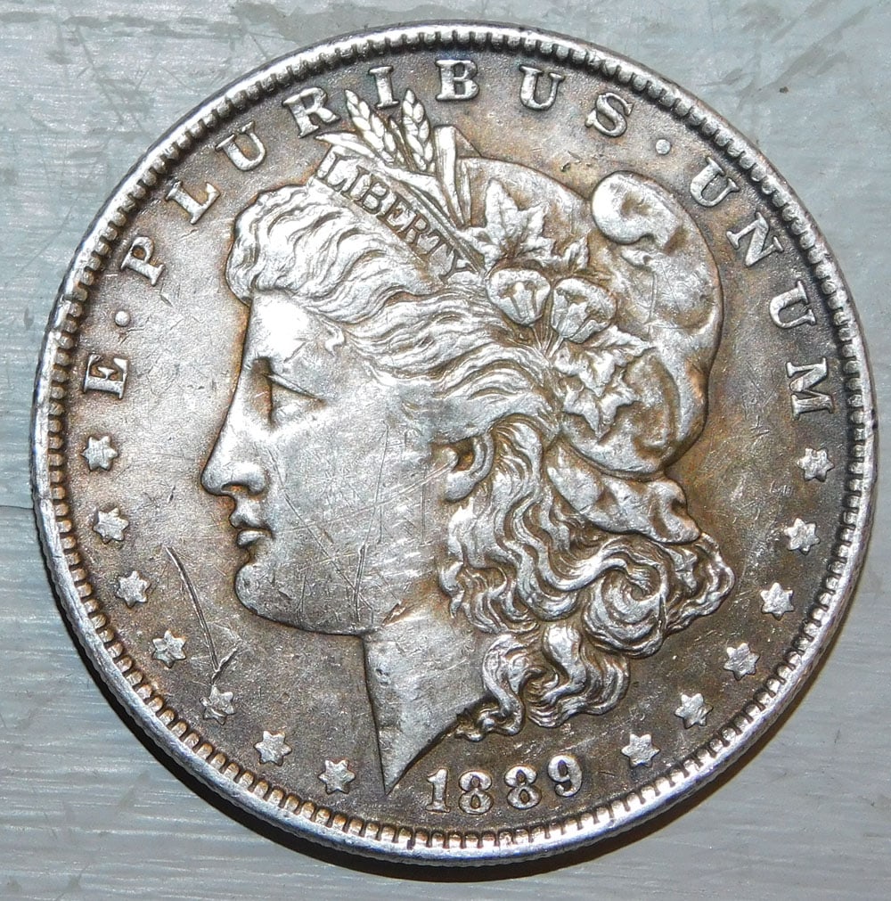 1889 Morgan Silver Dollar: 1889 Morgan Silver Dollar. ALL DESCRIPTIONS AND ANY CONDITION STATEMENT GIVEN BY LANGSTON AUCTION GALLERY ARE STRICTLY OPINIONS AND LANGSTON'S SHALL HAVE NO RESPONSIBILITY FOR ERRORS OR OMISSIONS.
