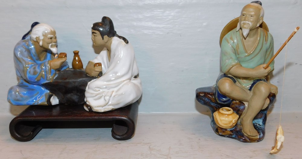 Two Oriental Mud Figures, (One on Teak Wood Stand): Two Oriental Mud Figures, (One on Teak Wood Stand). 4" H 5 1/2" W ALL DESCRIPTIONS AND ANY CONDITION STATEMENT GIVEN BY LANGSTON AUCTION GALLERY ARE STRICTLY OPINIONS AND LANGSTON'S SHALL HAVE NO