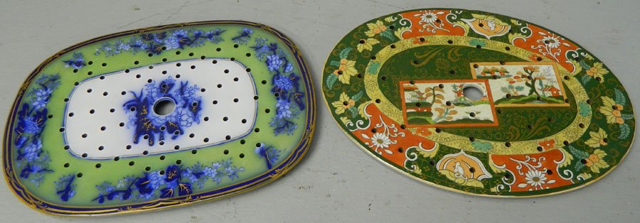 (2) Strainers.: (2) Strainers. One is flow blue and green and the other is a rust and green color. One is marked real ironstone. 13" x 9 1/4" and 13" x 9 1/2".