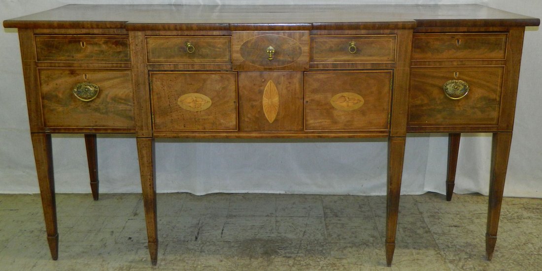 Period inlaid HW lock front sideboard.: Period inlaid Hepplewhite lock front sideboard with two cellarette drawers and 19th Century brasses. 75 1/2" x 27 1/4" x 38 1/2" tall.