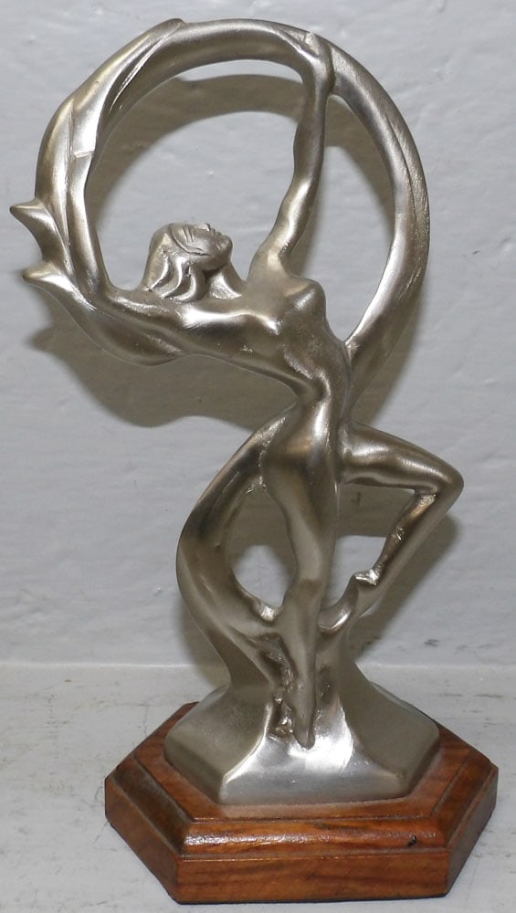 Pewter Dancing Woman Sculpture on Pine Wood Base: Pewter Dancing Woman Sculpture on Pine Wood Base . 10" H 5 1/4" W 3" D "ALL DESCRIPTIONS AND ANY CONDITION STATEMENT GIVEN BY LANGSTON AUCTION GALLERY ARE STRICTLY?OPINIONS?AND LANGSTON'S SHALL HAVE