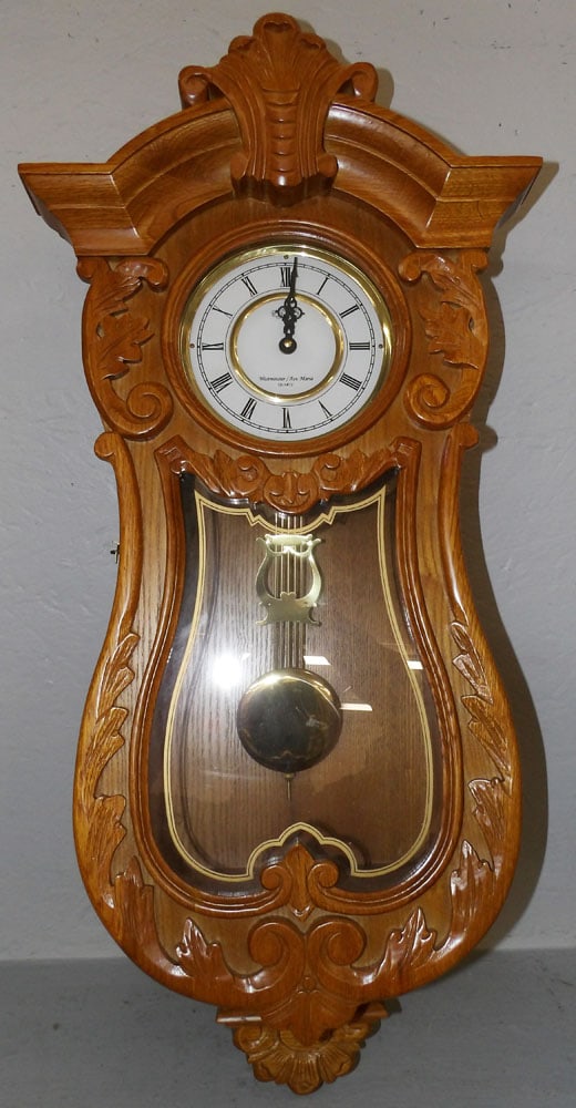 Carved Oak Decorative Clock: Carved Oak Decorative Clock . 30" H 14 1/4" W 6 3/4" D "ALL DESCRIPTIONS AND ANY CONDITION STATEMENT GIVEN BY LANGSTON AUCTION GALLERY ARE STRICTLY?OPINIONS?AND LANGSTON'S SHALL HAVE NO
