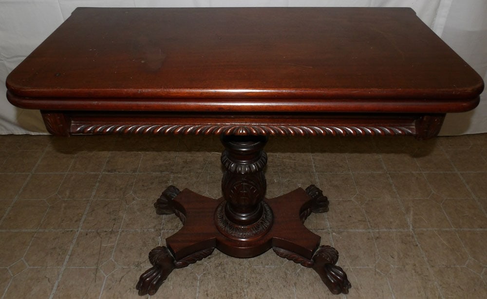 Carved Mahogany Fold Over Top Game Table: Carved Mahogany Fold Over Top Game Table . 30 1/4" H 35 3/4" W 18" D "ALL DESCRIPTIONS AND ANY CONDITION STATEMENT GIVEN BY LANGSTON AUCTION GALLERY ARE STRICTLY?OPINIONS?AND LANGSTON'S SHALL HAVE NO
