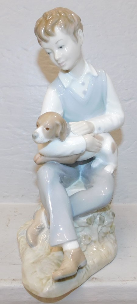 Zaphir Figure of Young Man with Puppy: Zaphir Figure of Young Man with Puppy. 10" H 6 1/2" W "ALL DESCRIPTIONS AND ANY CONDITION STATEMENT GIVEN BY LANGSTON AUCTION GALLERY ARE STRICTLY?OPINIONS?AND LANGSTON'S SHALL HAVE NO