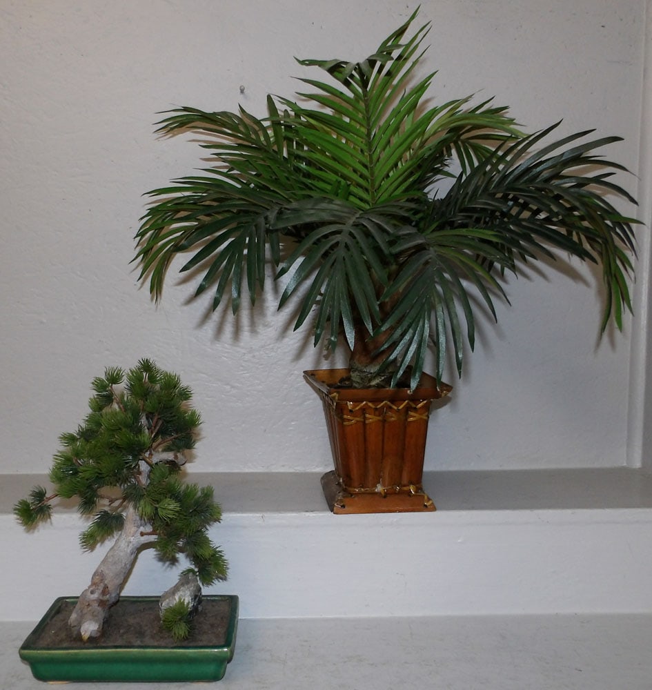Two Faux Plants, One with Pottery Base & One with Bamboo Base: Two Faux Plants, One with Pottery Base & One with Bamboo Base. Up to 22" H 22" W ALL DESCRIPTIONS AND ANY CONDITION STATEMENT GIVEN BY LANGSTON AUCTION GALLERY ARE STRICTLY OPINIONS AND LANGSTON'S SHA