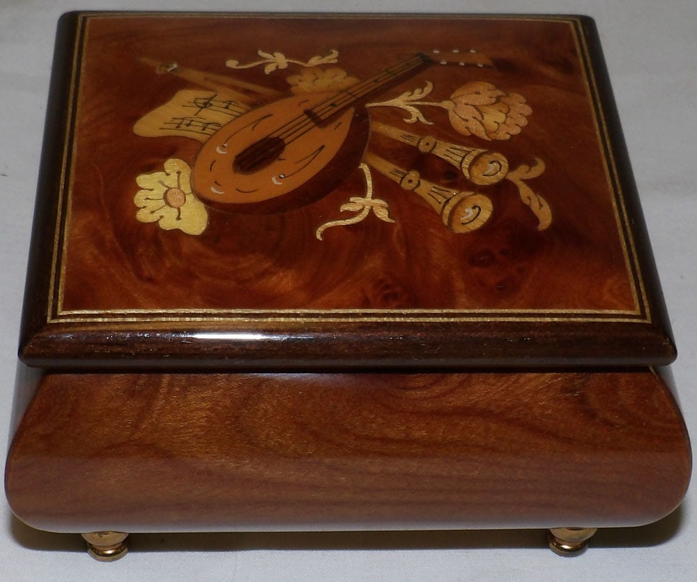 Burled Wood Inlaid Italian Music Box: Burled Wood Inlaid Italian Music Box . 2 1/4" H 4" W 3 1/2" D ALL DESCRIPTIONS AND ANY CONDITION STATEMENT GIVEN BY LANGSTON AUCTION GALLERY ARE STRICTLY OPINIONS AND LANGSTON'S SHALL HAVE NO