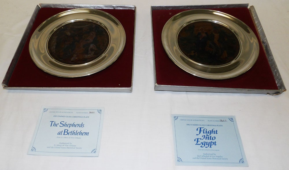 Two Pewter & Stained Glass Christmas Plates: Two Pewter & Stained Glass Christmas Plates . 10" Dia. ALL DESCRIPTIONS AND ANY CONDITION STATEMENT GIVEN BY LANGSTON AUCTION GALLERY ARE STRICTLY OPINIONS AND LANGSTON'S SHALL HAVE NO RESPONSIBILITY