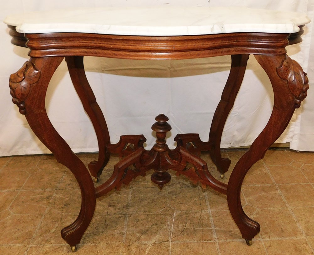 Antique Carved Walnut Victorian Turtle Shaped Marble Top Table: Antique Carved Walnut Victorian Turtle Shaped Marble Top Table . 27 3/4" H 35" W 23 3/4" D ALL DESCRIPTIONS AND ANY CONDITION STATEMENT GIVEN BY LANGSTON AUCTION GALLERY ARE STRICTLY OPINIONS AND LANG