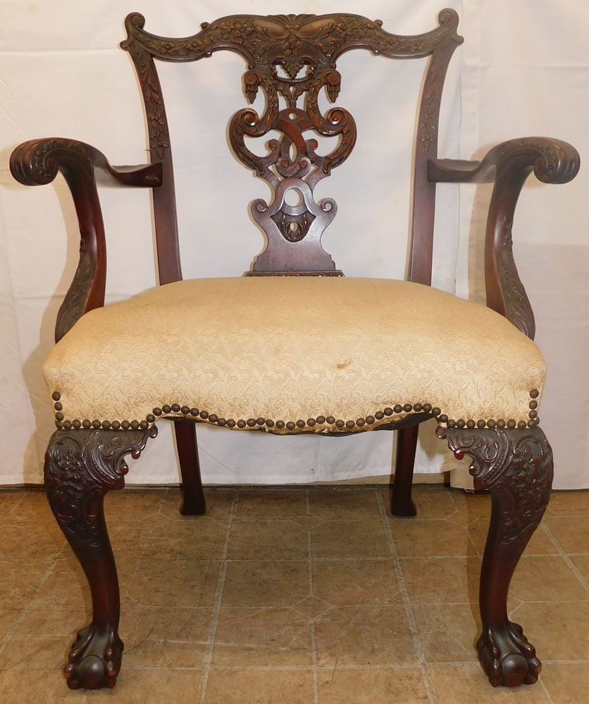 Carved Mahogany Arm Chair with Ball & Claw Feet: Carved Mahogany Arm Chair with Ball & Claw Feet. 37" H 27 1/4" W 22" D ALL DESCRIPTIONS AND ANY CONDITION STATEMENT GIVEN BY LANGSTON AUCTION GALLERY ARE STRICTLY OPINIONS AND LANGSTON'S SHALL HAVE NO