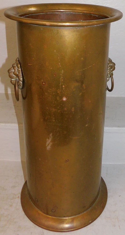Antique Brass Umbrella Stand with Lion Head Handles: Antique Brass Umbrella Stand with Lion Head Handles . 27 3/4" x 10 3/4" ALL DESCRIPTIONS AND ANY CONDITION STATEMENT GIVEN BY LANGSTON AUCTION GALLERY ARE STRICTLY OPINIONS AND LANGSTON'S SHALL HAVE N