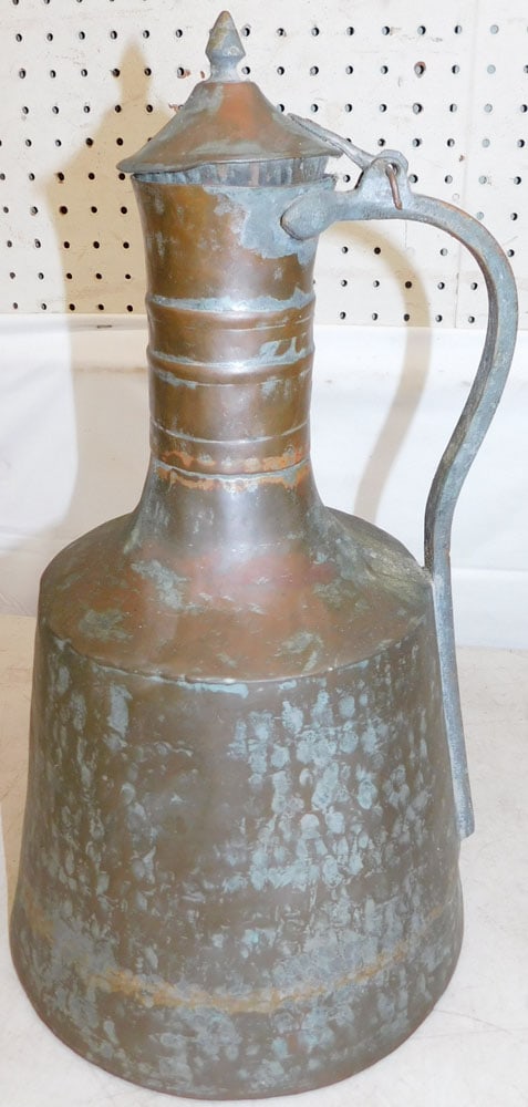 Antique Copper Jug: Antique Copper Jug . 17 1/4" H 9 3/4" Dia. ALL DESCRIPTIONS AND ANY CONDITION STATEMENT GIVEN BY LANGSTON AUCTION GALLERY ARE STRICTLY OPINIONS AND LANGSTON'S SHALL HAVE NO RESPONSIBILITY FOR ERRORS