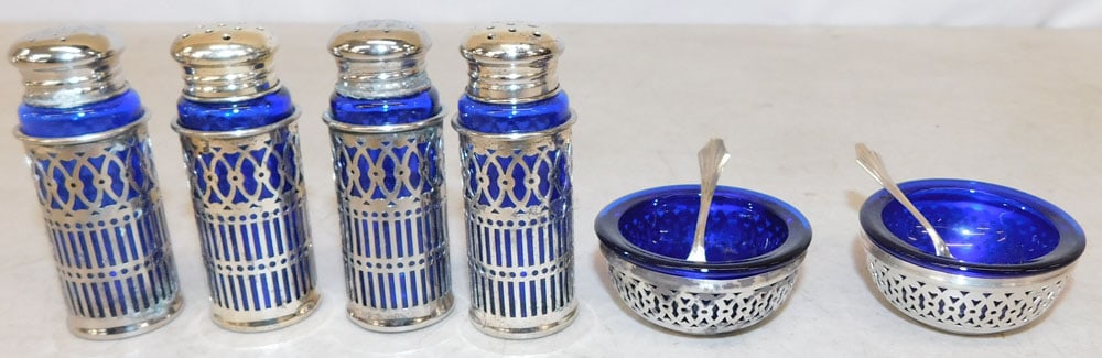 Four Cobalt Blue Silverplated Salt & Pepper Shakers & Two Master Salts with Spoons: Four Cobalt Blue Silverplated Salt & Pepper Shakers & Two Master Salts with Spoons. Up to 2 1/2" H ALL DESCRIPTIONS AND ANY CONDITION STATEMENT GIVEN BY LANGSTON AUCTION GALLERY ARE STRICTLY OPINIONS 