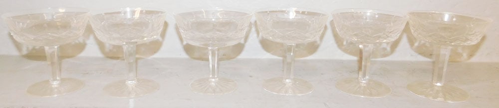 Six Waterford Crystal Champagnes, "Lismore": Six Waterford Crystal Champagnes, "Lismore". 4 1/4" H 4 1/4" Dia. ALL DESCRIPTIONS AND ANY CONDITION STATEMENT GIVEN BY LANGSTON AUCTION GALLERY ARE STRICTLY OPINIONS AND LANGSTON'S SHALL HAVE NO