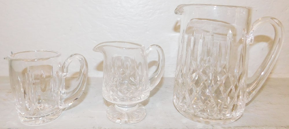 Three Waterford Crystal Pitchers: Three Waterford Crystal Pitchers . 6 3/4" H 6 1/2" W ALL DESCRIPTIONS AND ANY CONDITION STATEMENT GIVEN BY LANGSTON AUCTION GALLERY ARE STRICTLY OPINIONS AND LANGSTON'S SHALL HAVE NO RESPONSIBILITY FO