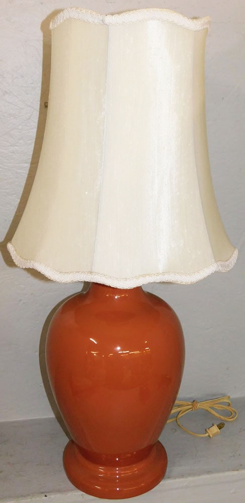 Mid Century Modern Orange Ceramic Urn Made Into Lamp: Mid Century Modern Orange Ceramic Urn Made Into Lamp. 30 1/4" H 8 1/2" Dia. ALL DESCRIPTIONS AND ANY CONDITION STATEMENT GIVEN BY LANGSTON AUCTION GALLERY ARE STRICTLY OPINIONS AND LANGSTON'S SHALL HA
