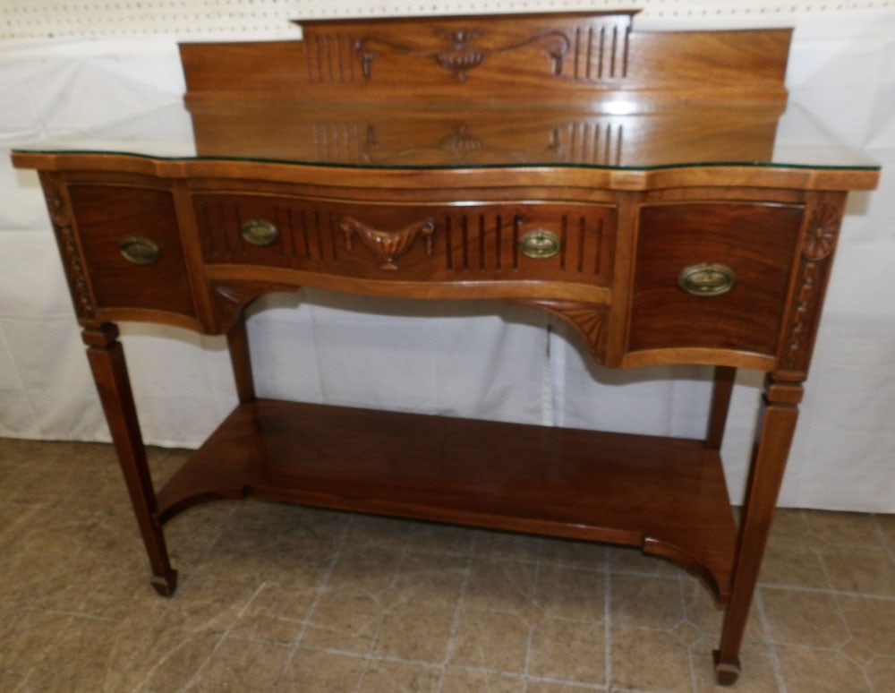 Mahogany Serpentine Front Server: Mahogany Serpentine Front Server . 43 3/4" H 48 1/4" W 20 1/2" D ALL DESCRIPTIONS AND ANY CONDITION STATEMENT GIVEN BY LANGSTON AUCTION GALLERY ARE STRICTLY OPINIONS AND LANGSTON'S SHALL HAVE NO RESPO