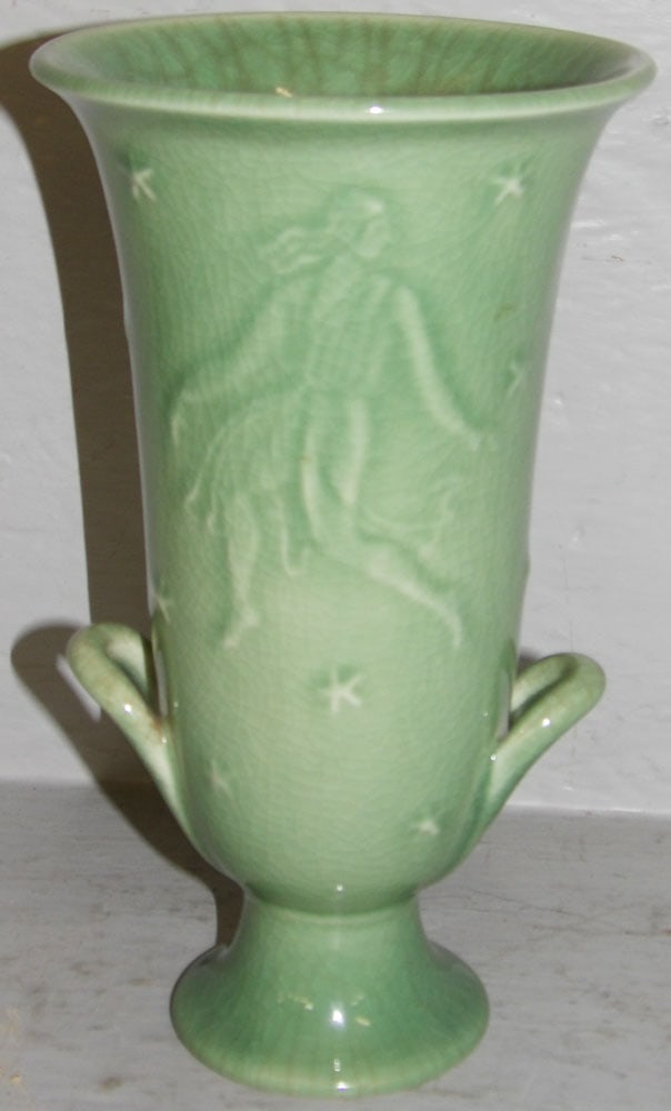 Rookwood Pottery Celadon Green Vase with Female Dancers & Stars: Rookwood Pottery Celadon Green Vase with Female Dancers & Stars. 9 1/4" H 5 1/4" Dia. ALL DESCRIPTIONS AND ANY CONDITION STATEMENT GIVEN BY LANGSTON AUCTION GALLERY ARE STRICTLY OPINIONS AND